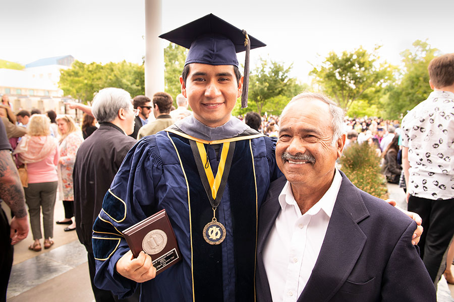 Dr. Jose Cota, School Medal recipient, with his father
