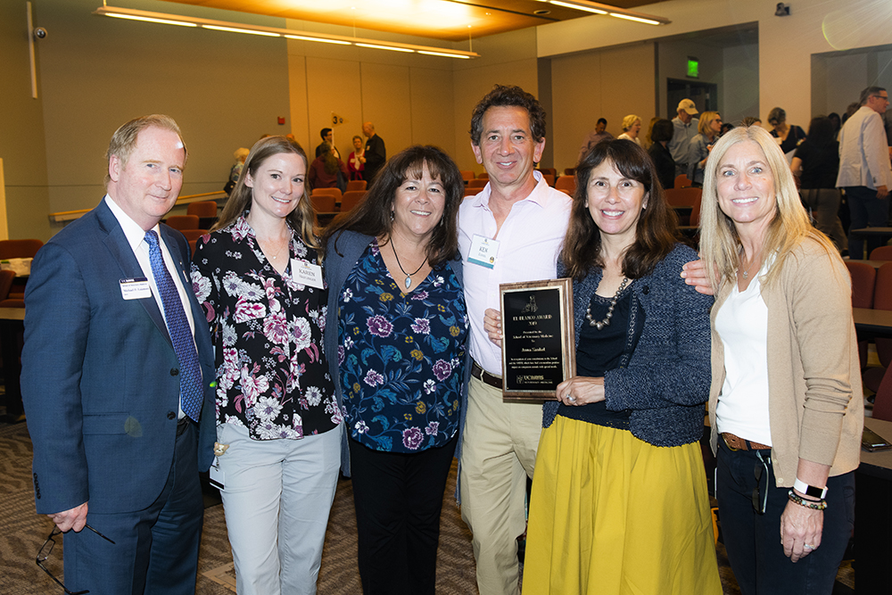 Anna Zankel (second from the right) accepting the El Blanco Award with her husband Ken (third from right) from Dean Michael Lairmore (far left), with additional guests.